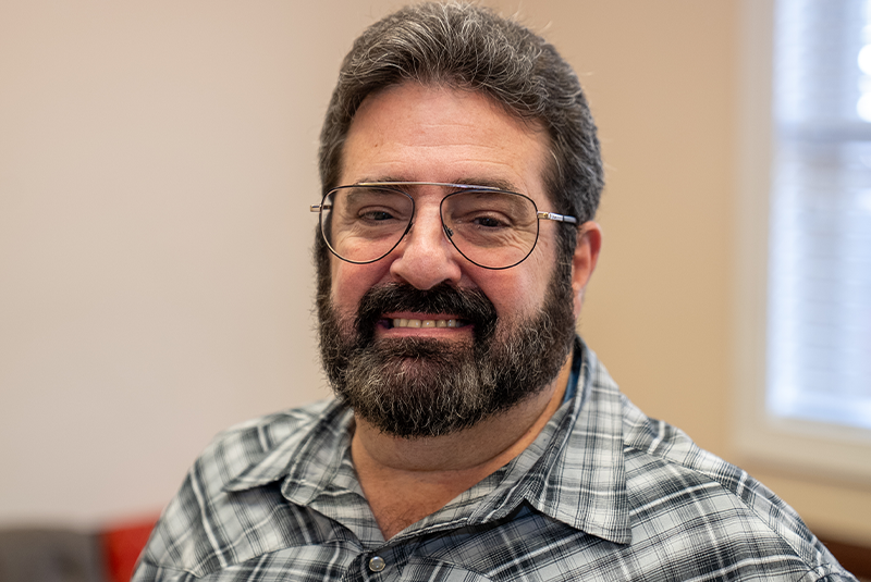 patient Michael smiling. Hear his story